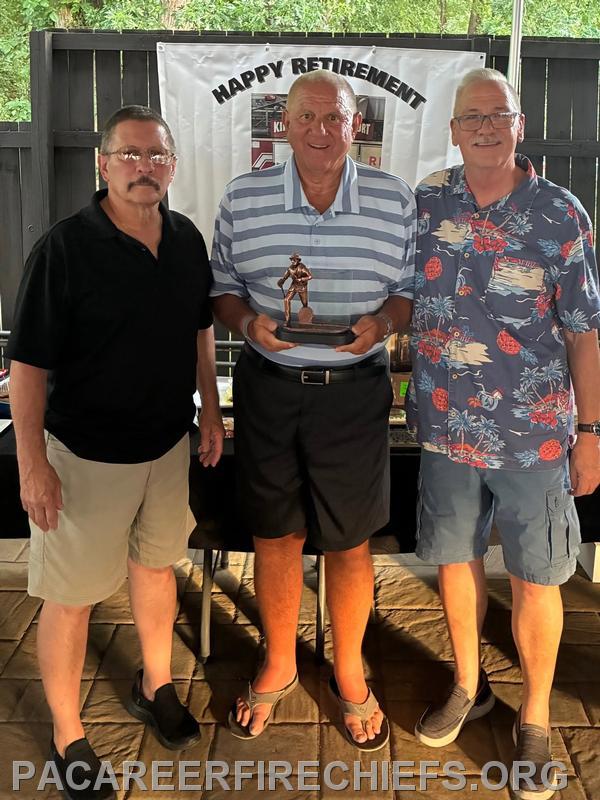 Fire Chief Frank Guido retired in June after 46 years of service. Presenting him with the PACFCA retirement plaque is Chiefs Delaney and Temarantz. July 2026